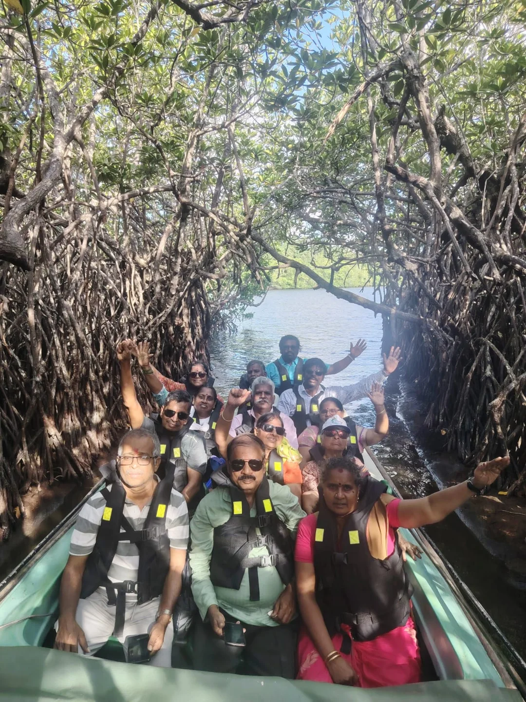 Rock Tours travellers sharing a boat ride through a Sri Lankan mangrove tunnel